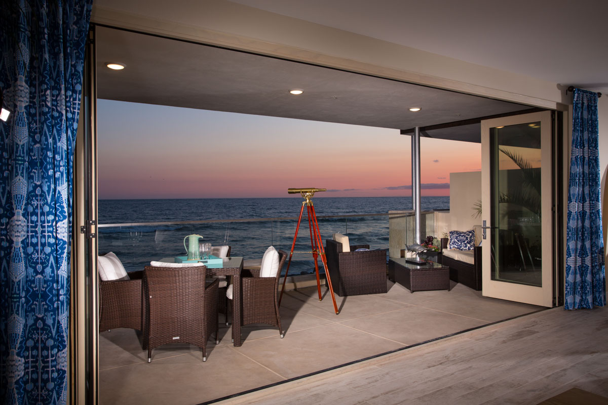 Balcony over looking the oceanfront at sunset at The Strand
