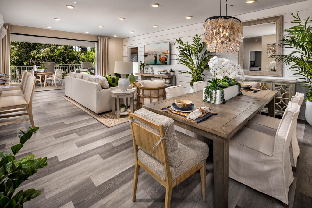 Open-concept dining room offering a picturesque view of the adjoining living room at Carlyle