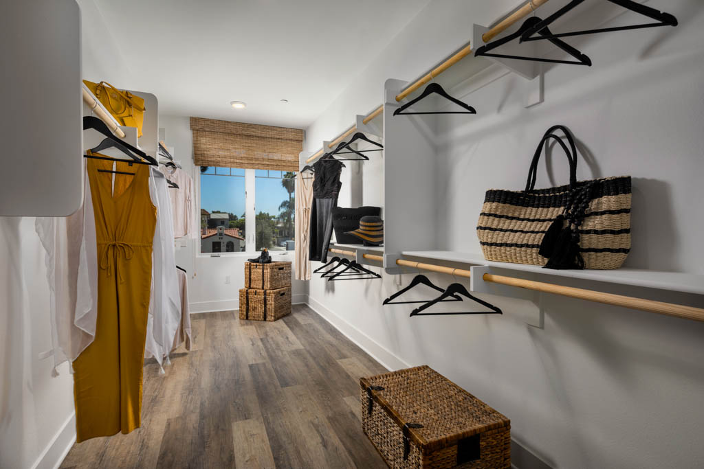 Spacious closet with wicker storage and hangers at Carlyle