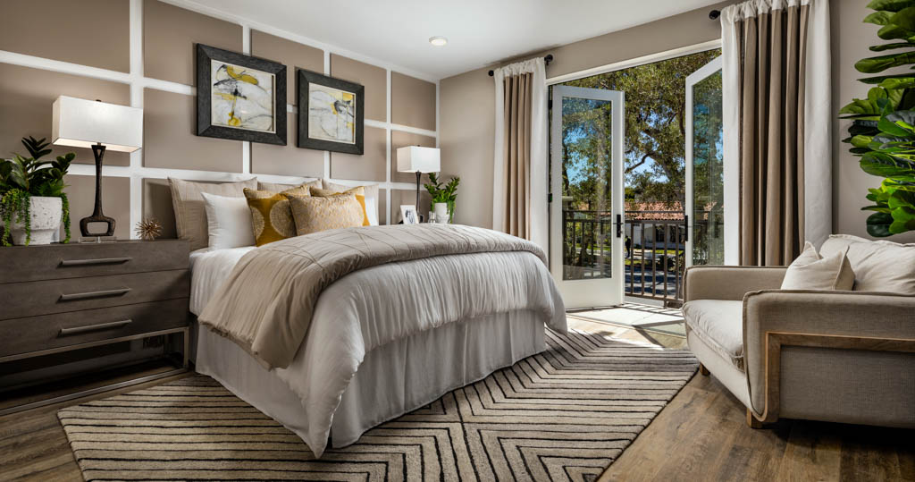 Master bedroom has overlooking balcony with glass doors at Carlyle
