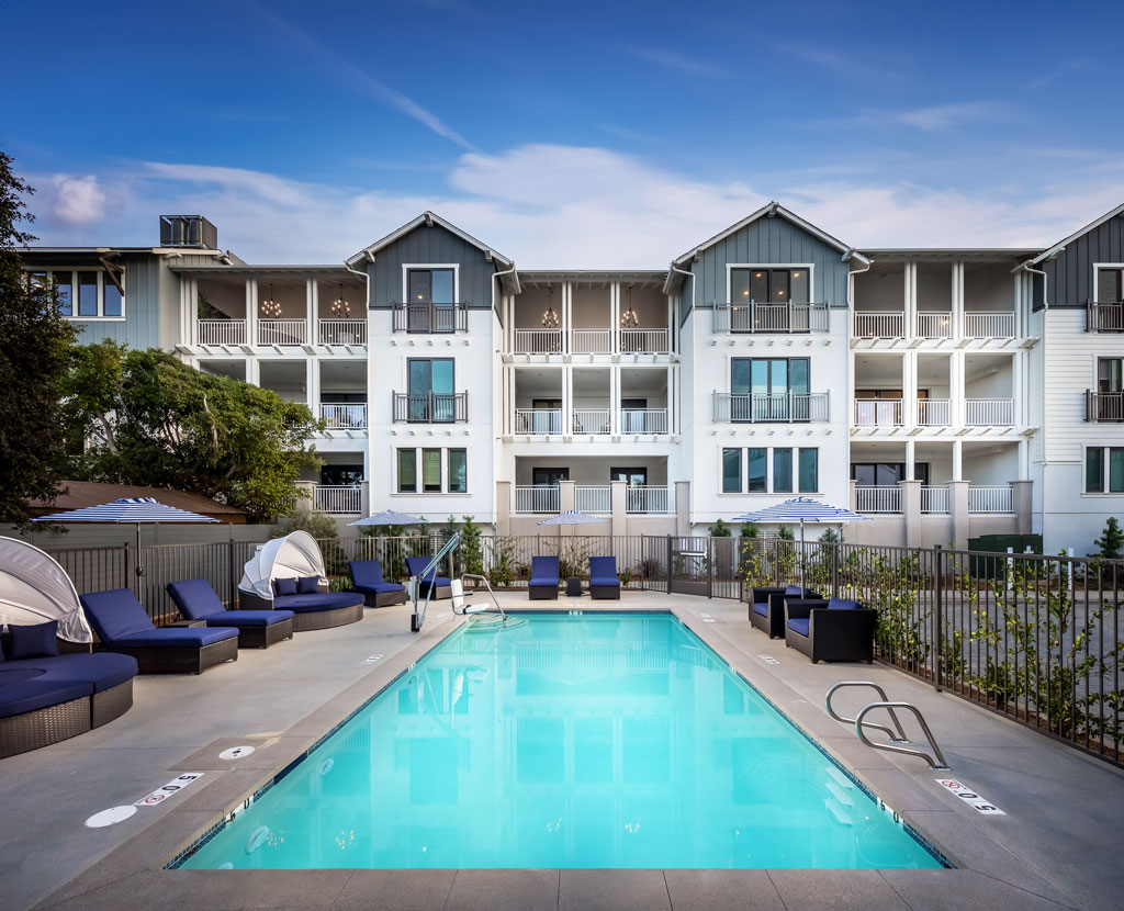 Outdoor oasis featuring a refreshing swimming pool in the backyard at Carlyle