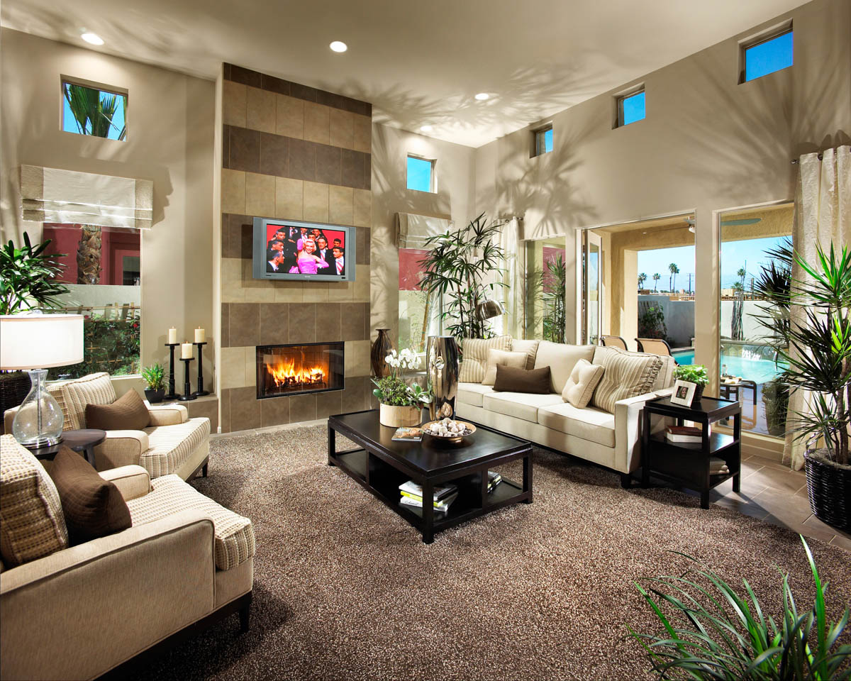 Living room area with view of pool through the windows at the Luminaire residence