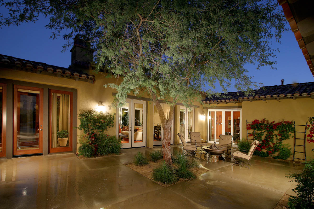 Back patio area with fire pit of the Monte Sereno home