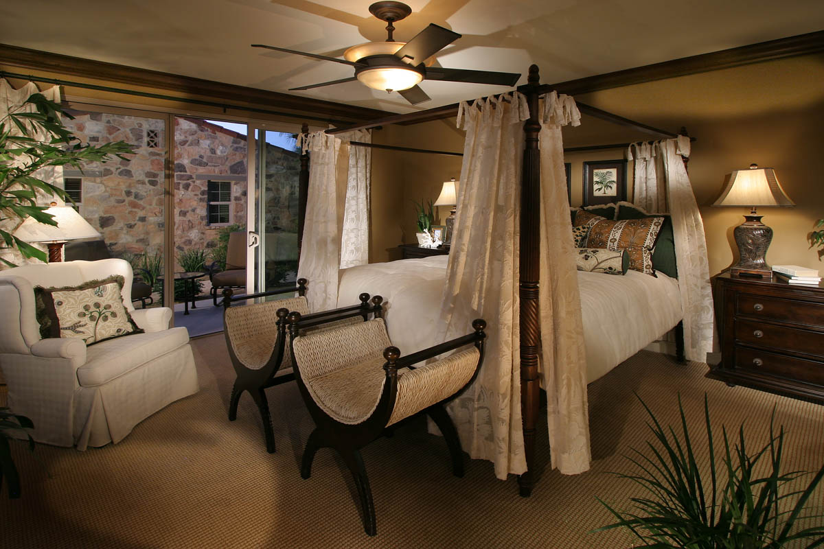 Bedroom with drapery and open sliding door at the Monte Sereno residence