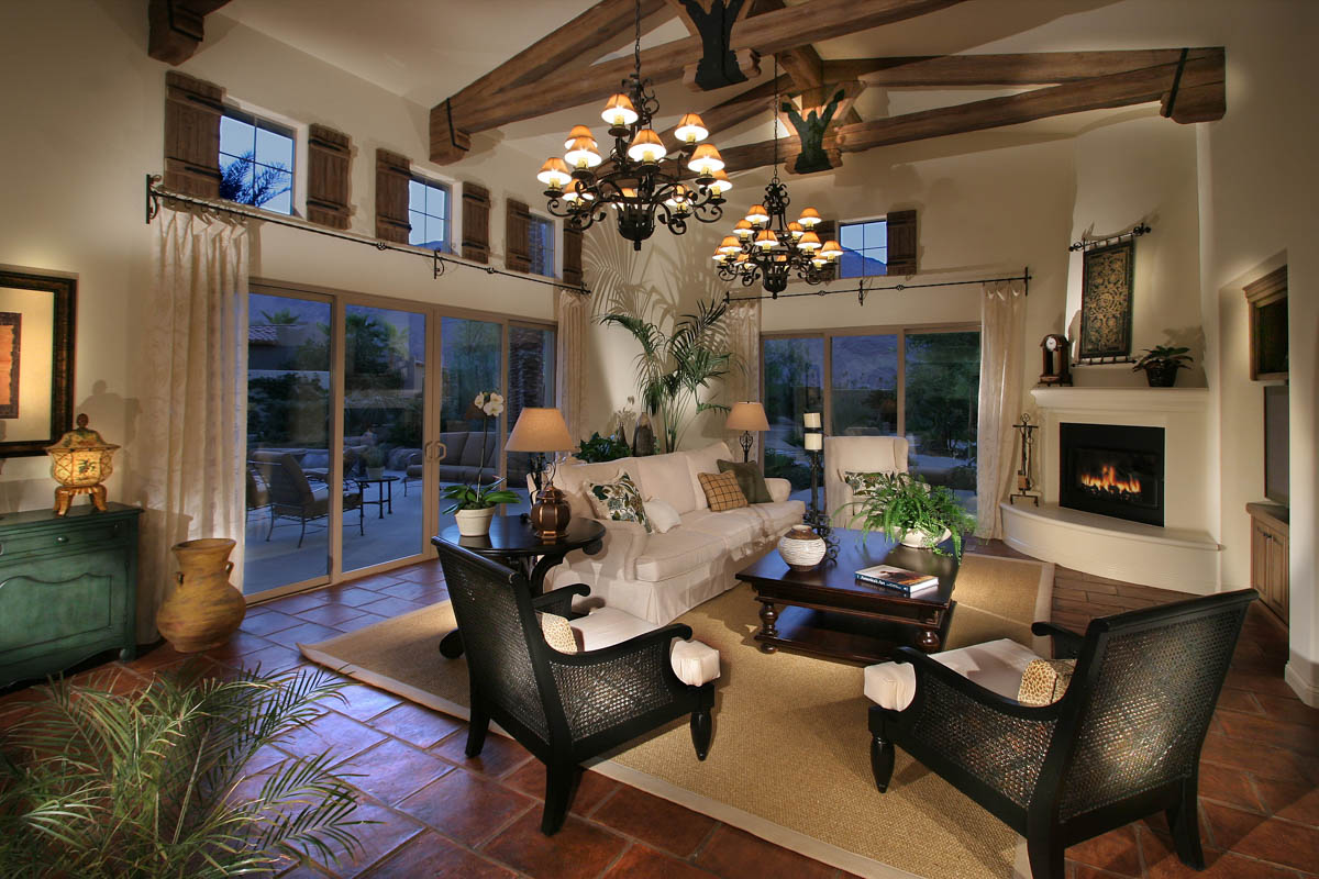 Luxury living room with chandeliers and fireplace at the Monte Sereno residence