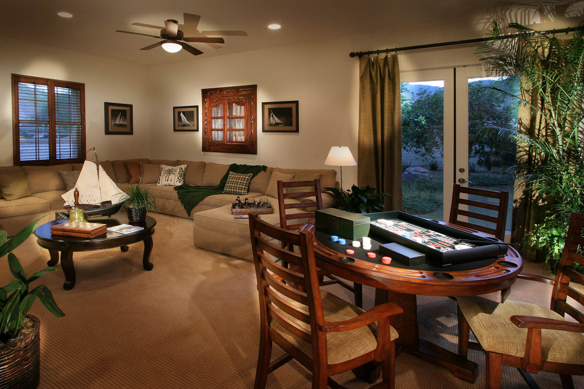 Sectional couch and poker game table at the Monte Sereno residence