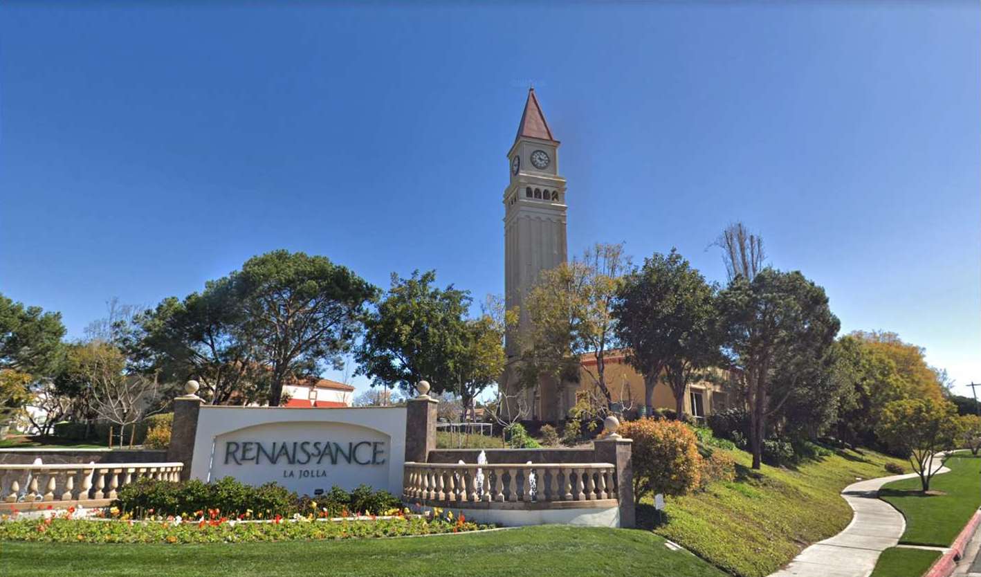 View of the pond with signage that says Renaissance La Jolla and clock tower in the background