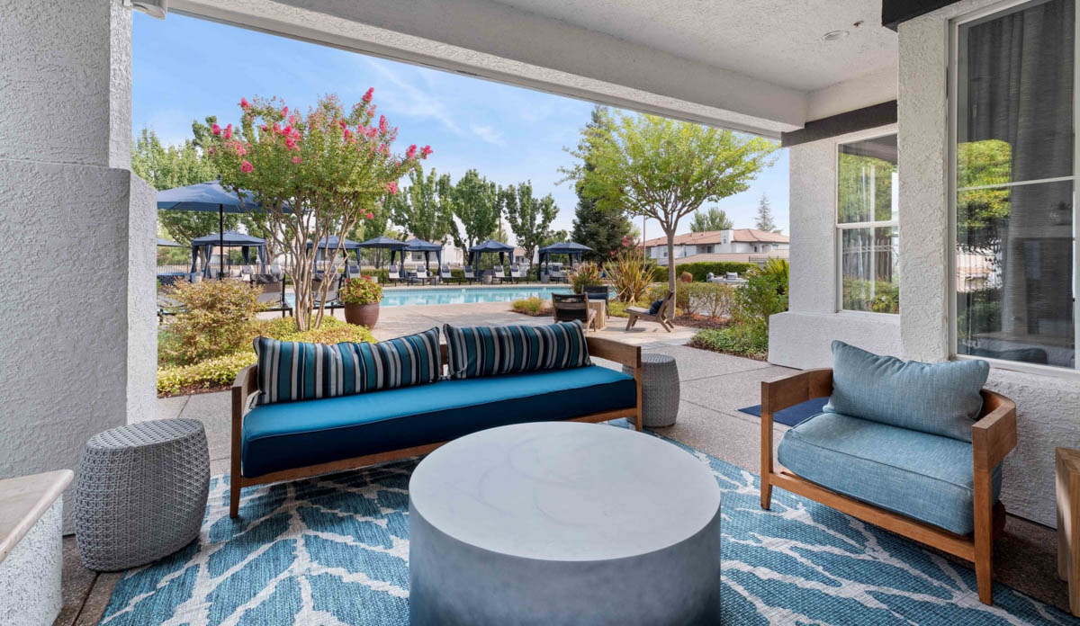 Resting area overlooking the pool at the Terraces at Highland development