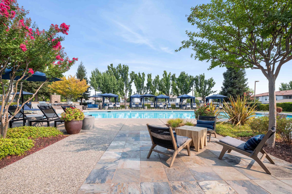 Overlooking the pool area surrounded by trees at the Terraces at Highland development