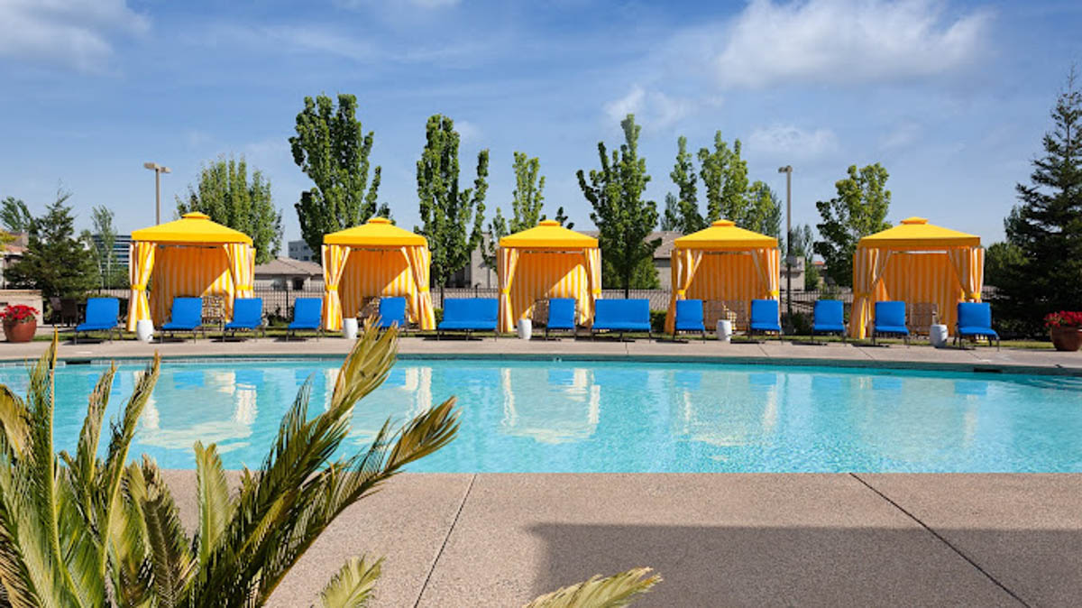 Overlooking the pool area at the Terraces at Highland development with yellow canopies and blue chairs