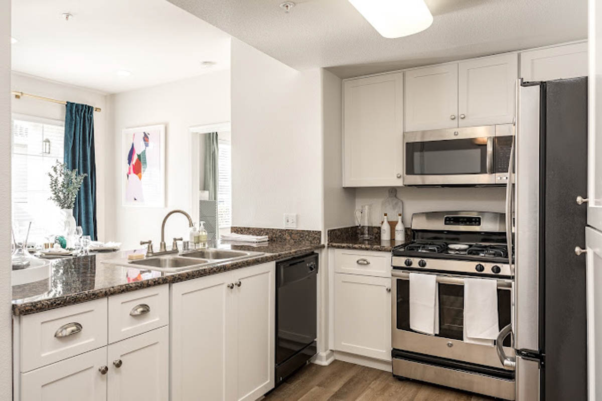 White and black kitchen area at the Terraces at Highland development