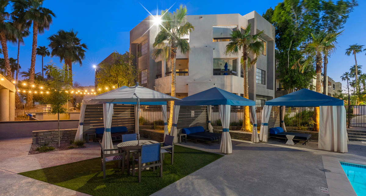 Outdoor canopies around the pool area at Paradise Lakes Apartments